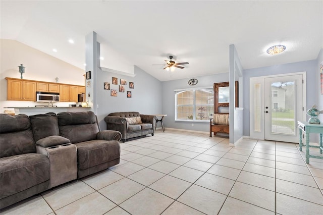 tiled living room featuring lofted ceiling and ceiling fan