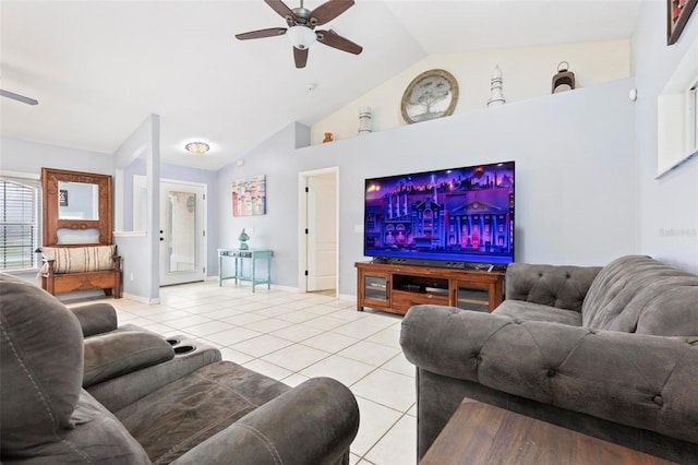 tiled living room with ceiling fan and high vaulted ceiling