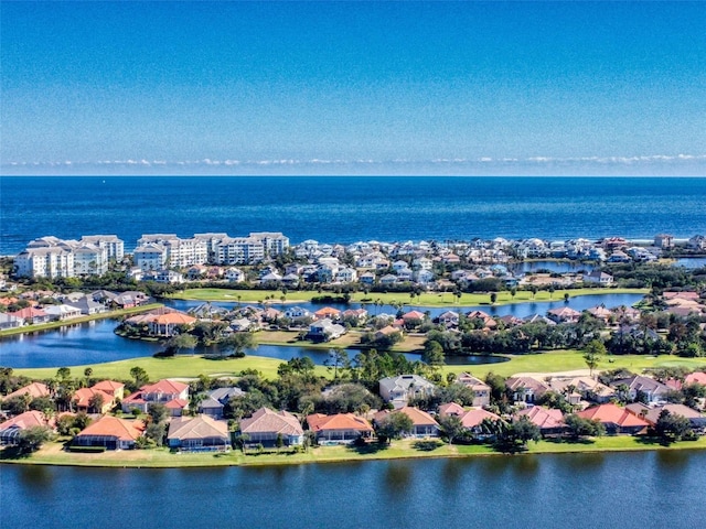 birds eye view of property featuring a water view