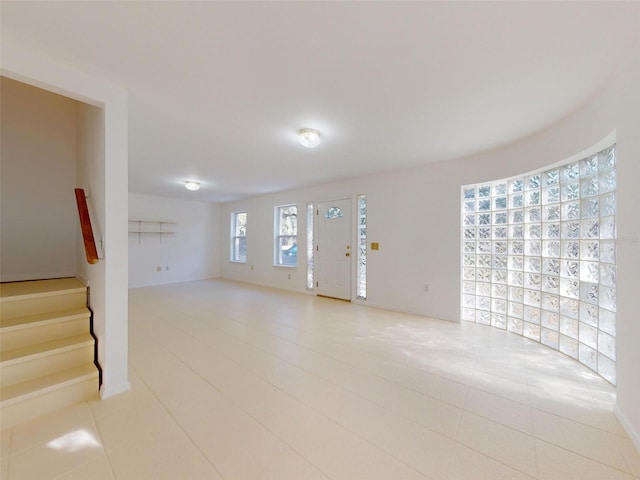 empty room with light tile patterned flooring