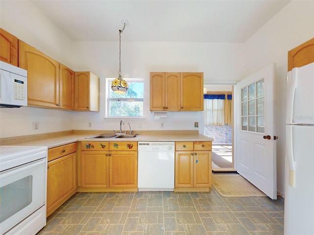 kitchen featuring pendant lighting, light brown cabinets, white appliances, and sink