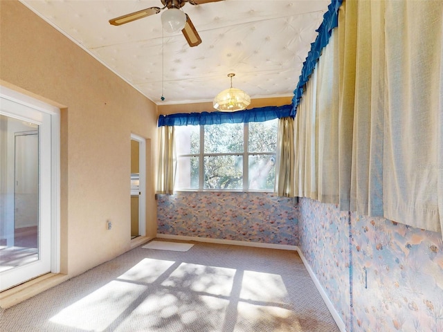 empty room with carpet flooring and ceiling fan