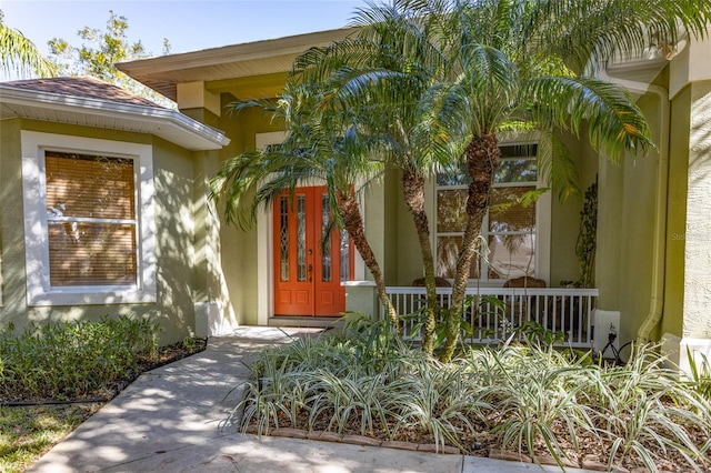 entrance to property featuring a porch