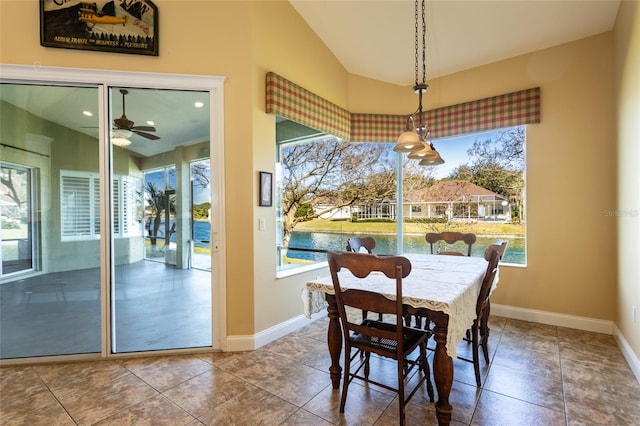 tiled dining room with ceiling fan and a wealth of natural light