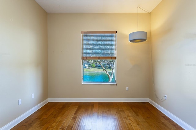 unfurnished room featuring hardwood / wood-style floors