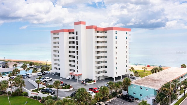 1183 Ocean Shore Blvd Unit 6040, Ormond Beach, FL 32176 - view of building exterior with uncovered parking and a water view