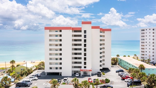 1183 Ocean Shore Blvd Unit 6040, Ormond Beach, FL 32176 - view of apartment building / complex with uncovered parking and a water view