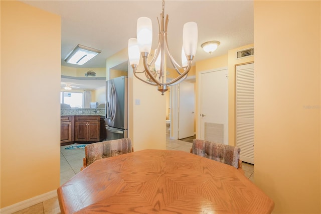 1183 Ocean Shore Blvd Unit 6040, Ormond Beach, FL 32176 - dining space with light tile patterned floors and a chandelier