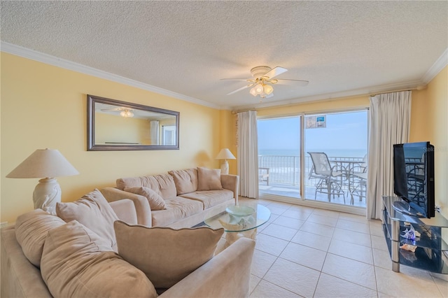 1183 Ocean Shore Blvd Unit 6040, Ormond Beach, FL 32176 - living room featuring crown molding, ceiling fan, light tile patterned flooring, and a textured ceiling