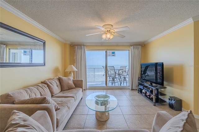 1183 Ocean Shore Blvd Unit 6040, Ormond Beach, FL 32176 - living area featuring ceiling fan, plenty of natural light, ornamental molding, a textured ceiling, and light tile patterned flooring
