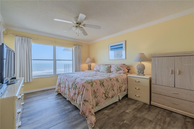 bedroom featuring dark hardwood / wood-style flooring, a textured ceiling, ceiling fan, crown molding, and a water view