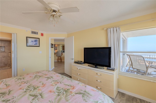 1183 Ocean Shore Blvd Unit 6040, Ormond Beach, FL 32176 - bedroom with crown molding, baseboards, ceiling fan, and a textured ceiling