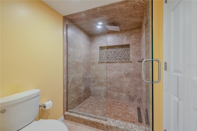 bathroom with walk in shower and toilet