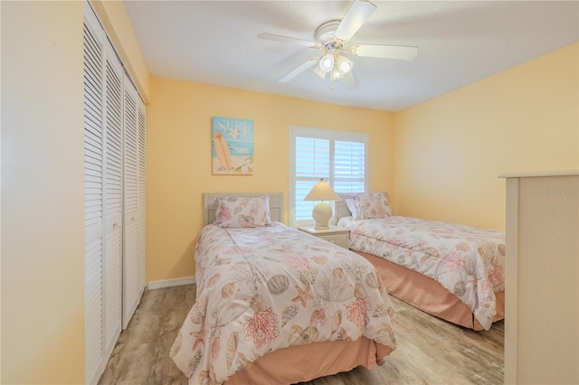 1183 Ocean Shore Blvd Unit 6040, Ormond Beach, FL 32176 - bedroom featuring wood finished floors, a closet, ceiling fan, and baseboards