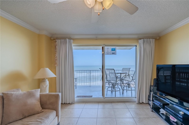 1183 Ocean Shore Blvd Unit 6040, Ormond Beach, FL 32176 - living room featuring ornamental molding, a ceiling fan, a textured ceiling, and light tile patterned floors