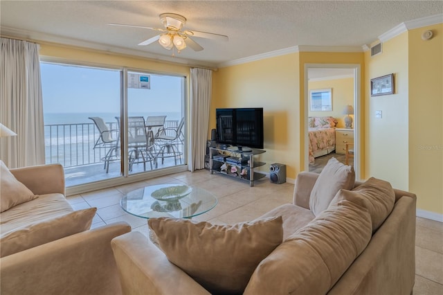 1183 Ocean Shore Blvd Unit 6040, Ormond Beach, FL 32176 - living room featuring ceiling fan, crown molding, tile patterned floors, a textured ceiling, and baseboards