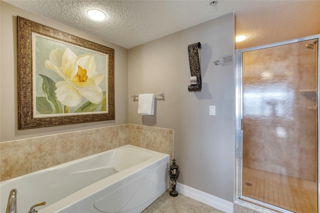 bathroom featuring shower with separate bathtub, a textured ceiling, and tile patterned floors