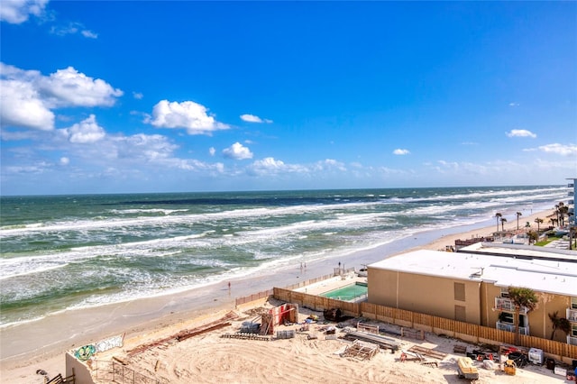 bird's eye view featuring a beach view and a water view