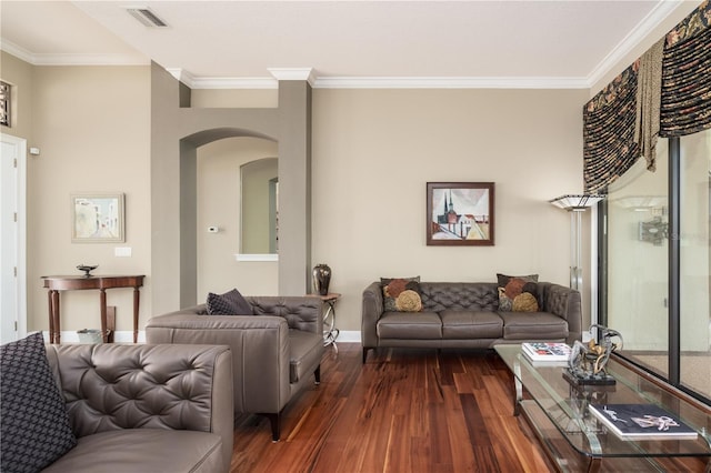 living room with baseboards, arched walkways, visible vents, dark wood finished floors, and crown molding