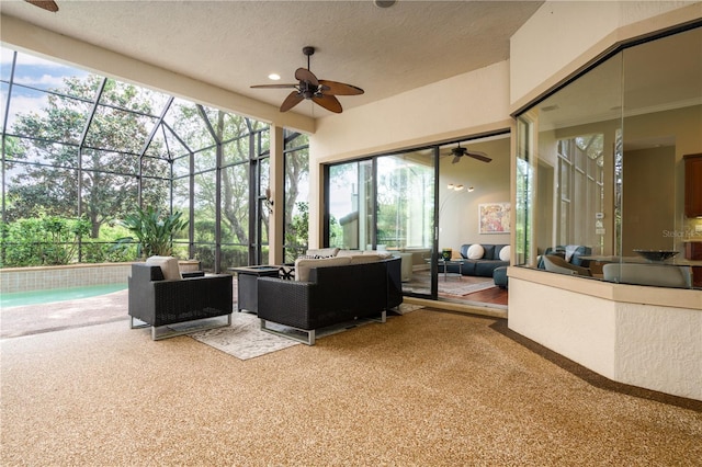 sunroom with ceiling fan