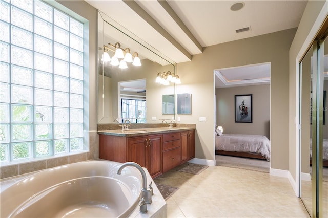 ensuite bathroom with a garden tub, a sink, visible vents, double vanity, and ensuite bath