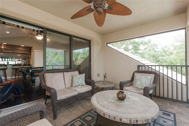 view of patio / terrace featuring ceiling fan, outdoor lounge area, and a balcony