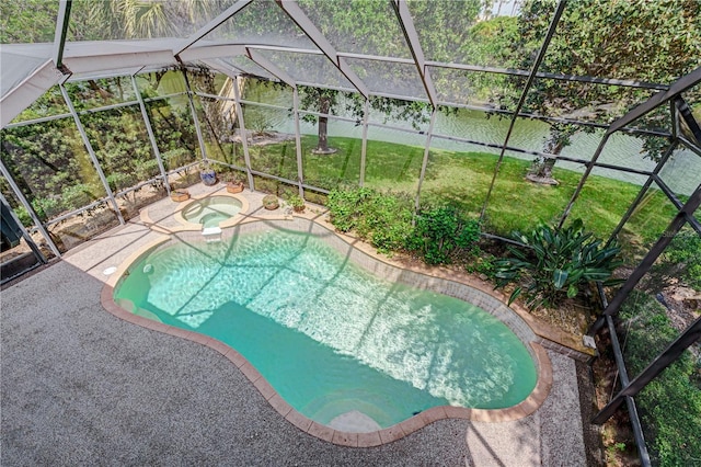 view of pool featuring a patio area, a pool with connected hot tub, glass enclosure, and a lawn