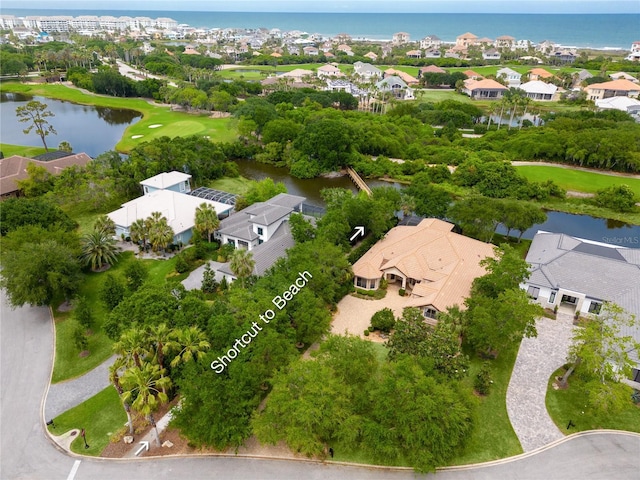 bird's eye view with a water view and a residential view