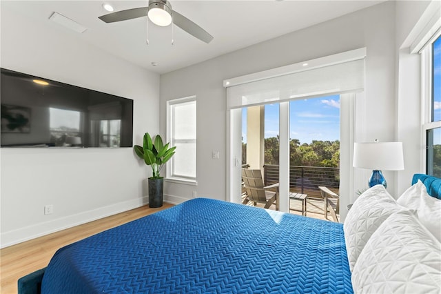 bedroom with access to exterior, ceiling fan, and hardwood / wood-style floors