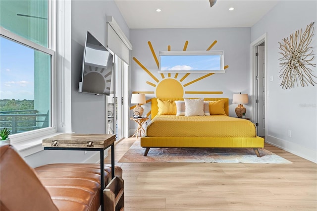 bedroom with light hardwood / wood-style flooring