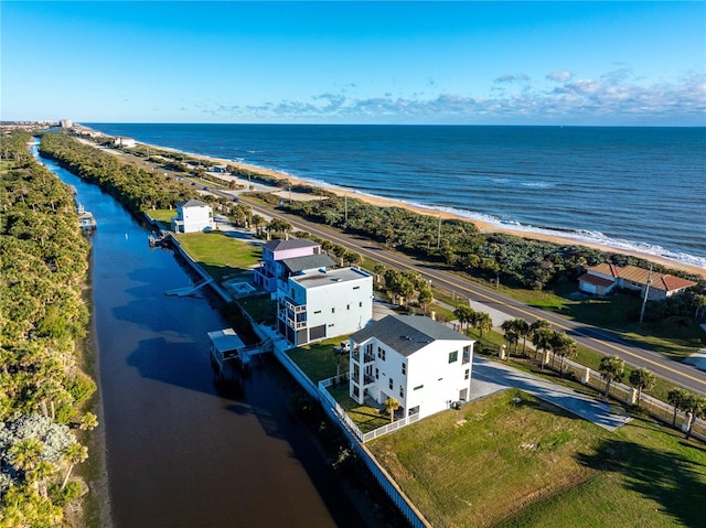 aerial view with a water view and a view of the beach