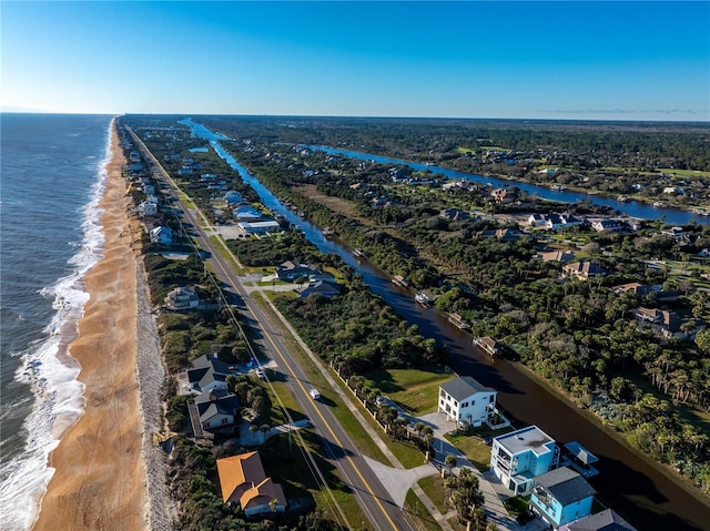 bird's eye view with a water view and a view of the beach