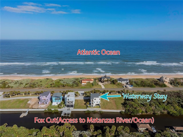 aerial view with a beach view and a water view