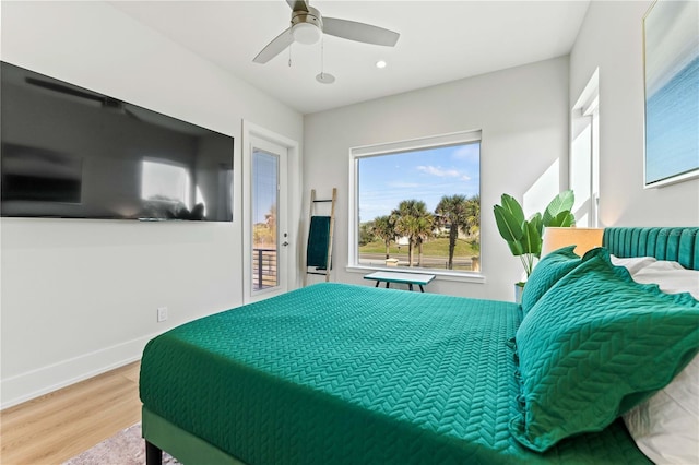 bedroom with access to outside, ceiling fan, and hardwood / wood-style floors