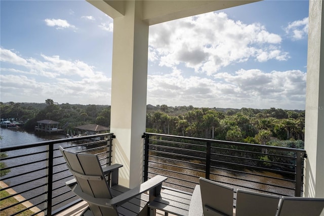 balcony featuring a water view