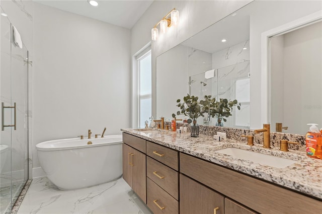 bathroom featuring vanity and shower with separate bathtub