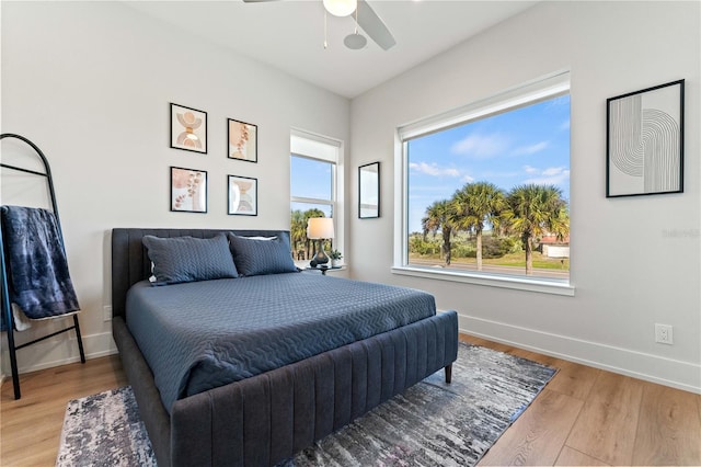 bedroom featuring hardwood / wood-style flooring and ceiling fan