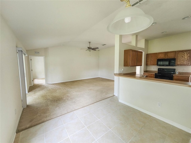 kitchen with ceiling fan, kitchen peninsula, light colored carpet, vaulted ceiling, and black appliances