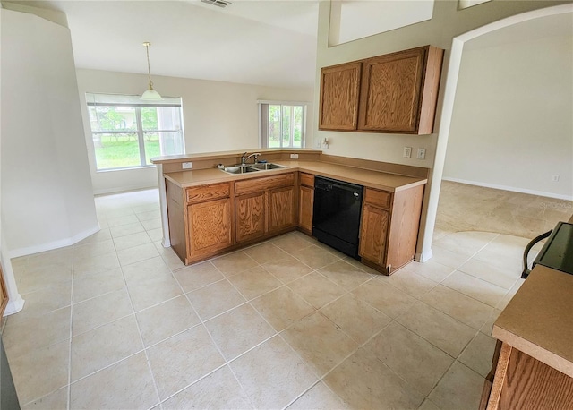 kitchen featuring black appliances, sink, vaulted ceiling, decorative light fixtures, and kitchen peninsula