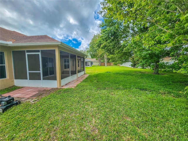 view of yard with a sunroom