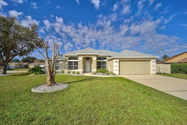 ranch-style home featuring a garage and a front yard