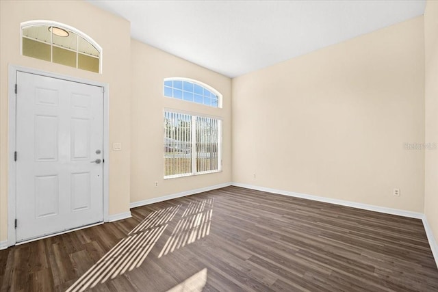 entryway with dark wood-type flooring