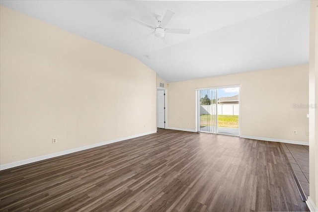 empty room with ceiling fan, lofted ceiling, and dark hardwood / wood-style flooring