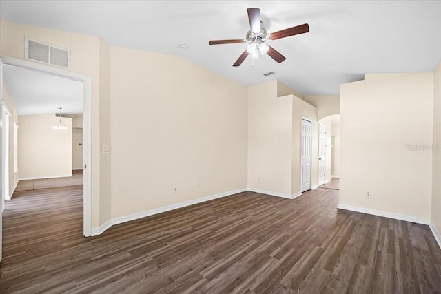 unfurnished living room featuring dark hardwood / wood-style floors and ceiling fan with notable chandelier