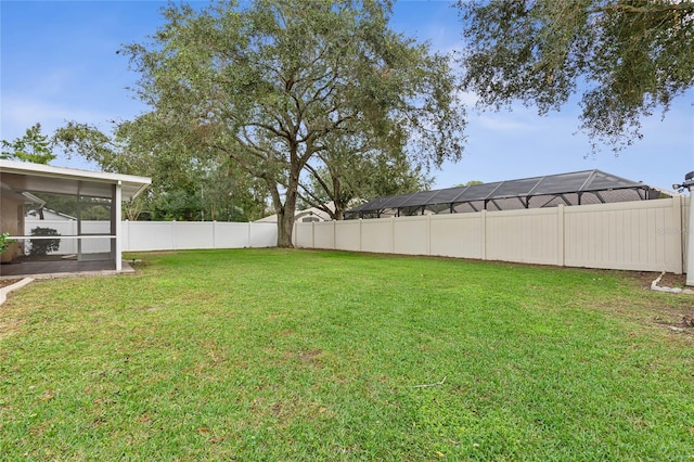 view of yard with a sunroom