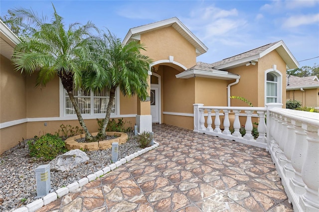 doorway to property with a porch