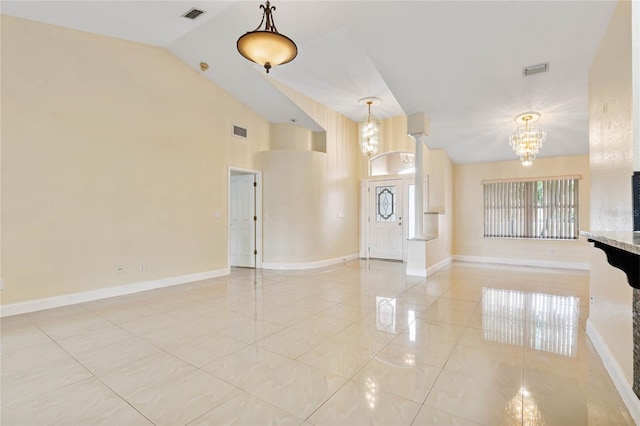 unfurnished living room featuring light tile patterned flooring, a chandelier, and vaulted ceiling