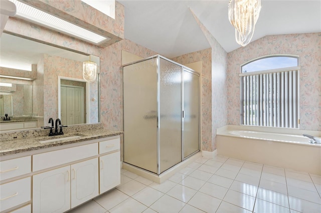 bathroom with tile patterned floors, vanity, vaulted ceiling, separate shower and tub, and an inviting chandelier