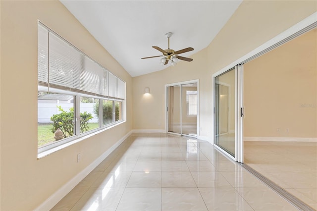 tiled spare room with ceiling fan and lofted ceiling