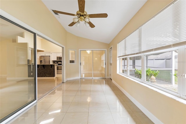 unfurnished sunroom featuring vaulted ceiling and ceiling fan